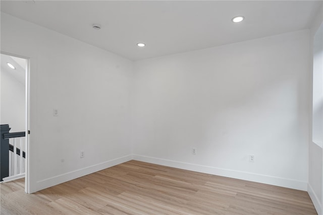 unfurnished room with light wood-type flooring