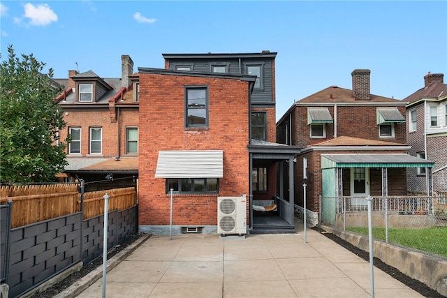 back of house featuring ac unit