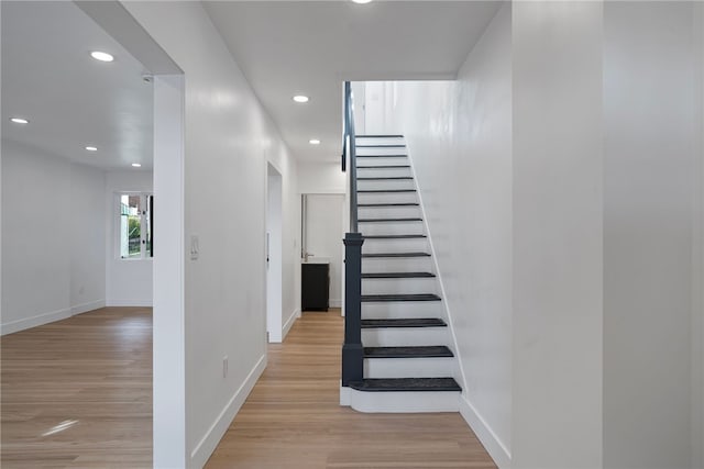 stairs with wood-type flooring