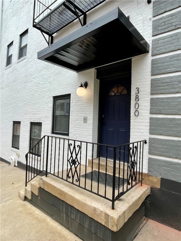 view of exterior entry with covered porch