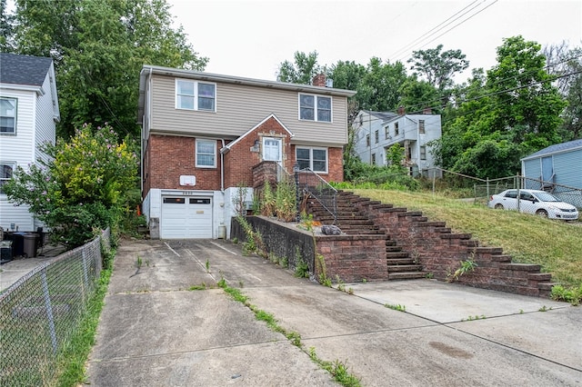 view of front of property with a garage