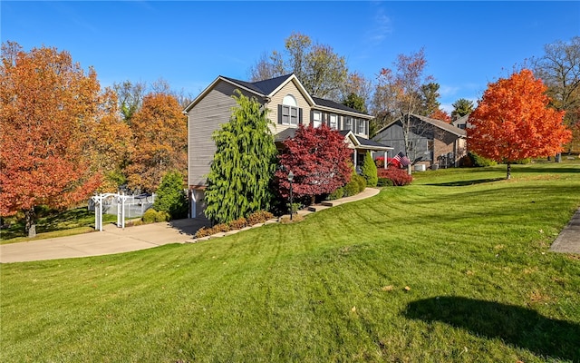 view of side of home featuring a lawn