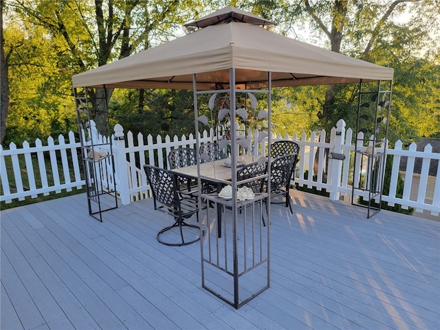 wooden terrace featuring a gazebo