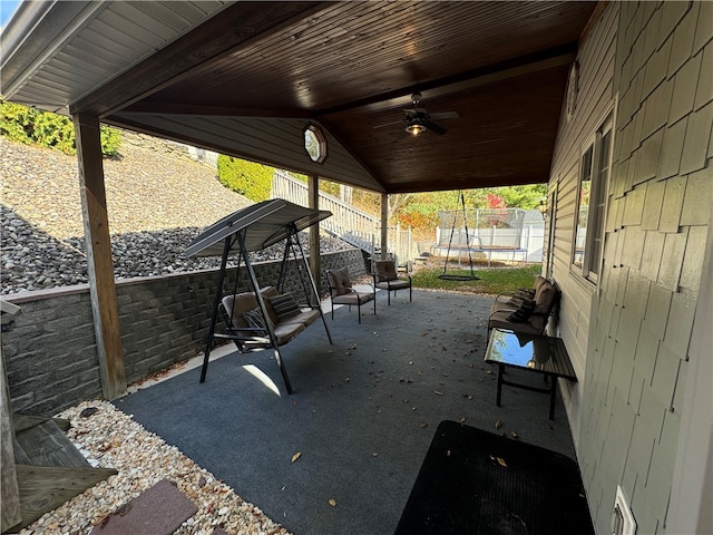 view of patio / terrace with a trampoline and ceiling fan