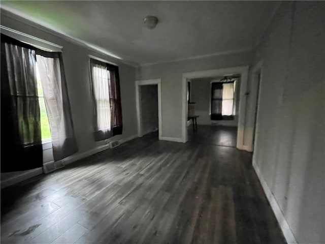 unfurnished room featuring dark wood-type flooring