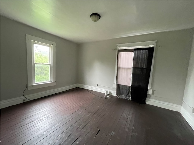 empty room featuring dark hardwood / wood-style floors