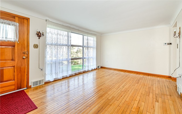 foyer with light wood-type flooring