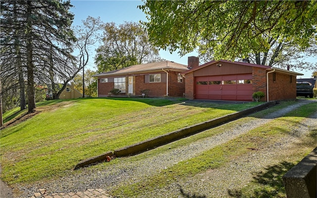 single story home featuring a front lawn and a garage