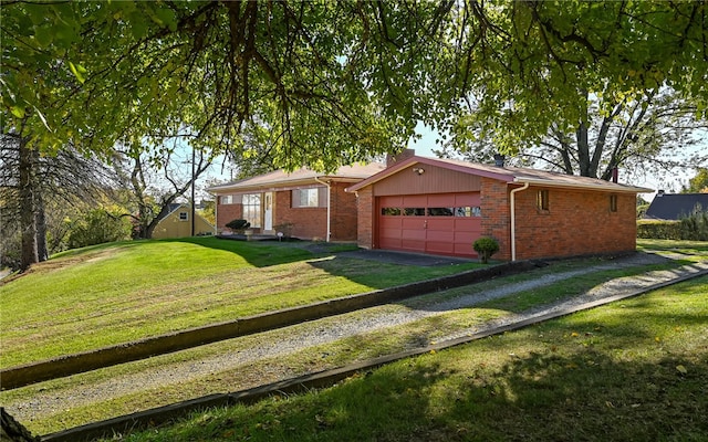 ranch-style house featuring a front yard and a garage