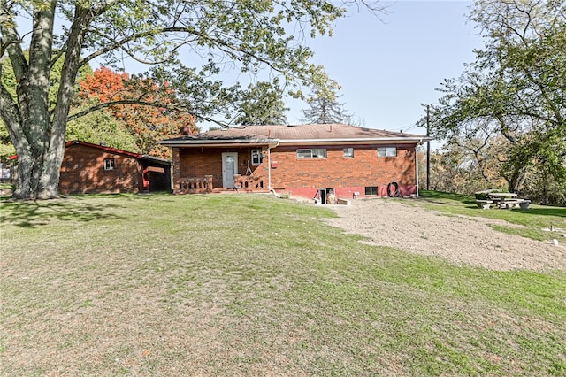 rear view of house with a lawn