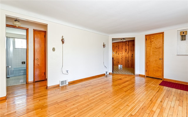 spare room featuring light hardwood / wood-style floors