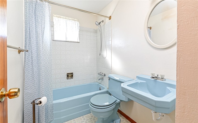 full bathroom with toilet, sink, and shower / tub combo
