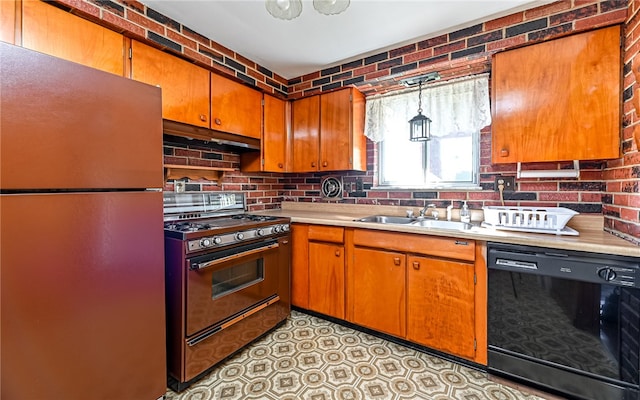 kitchen with sink, dishwasher, refrigerator, gas stove, and pendant lighting