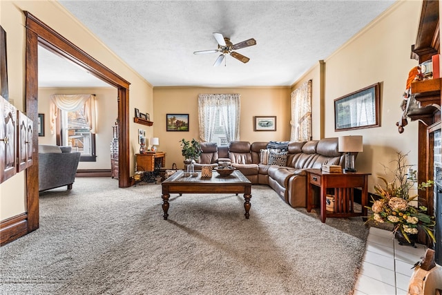 living room featuring light carpet, crown molding, a textured ceiling, and ceiling fan