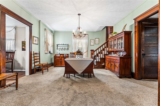 dining room with a textured ceiling, plenty of natural light, and light colored carpet