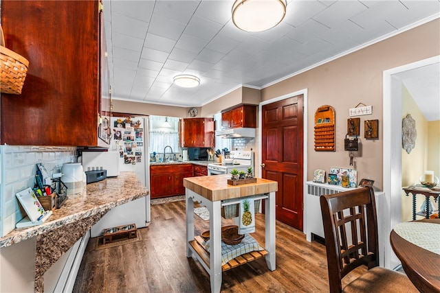 kitchen featuring dark hardwood / wood-style flooring, backsplash, crown molding, light stone counters, and white appliances