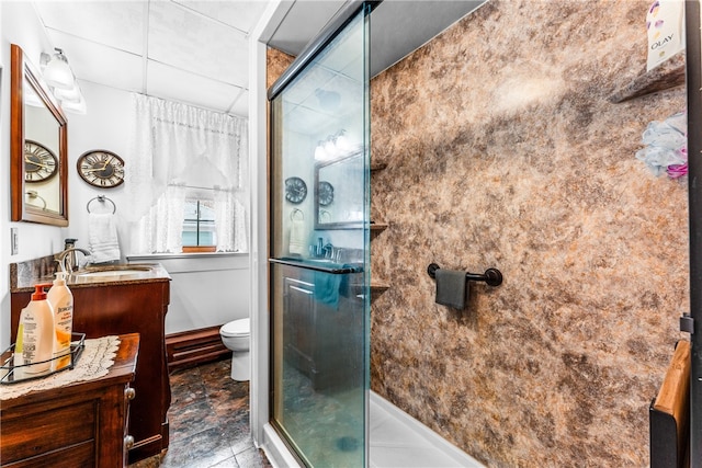 bathroom with vanity, an enclosed shower, toilet, and tile patterned flooring