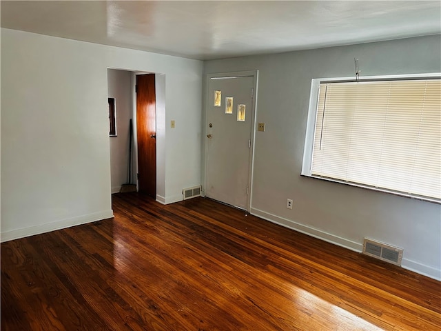 interior space with dark hardwood / wood-style flooring