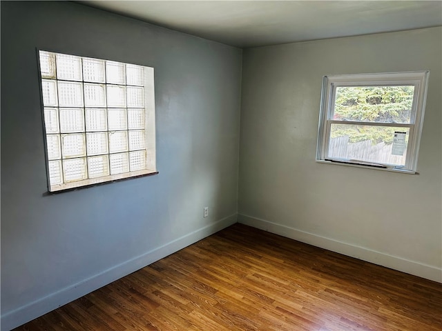 unfurnished room featuring hardwood / wood-style floors