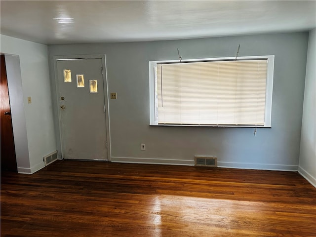 entrance foyer featuring dark hardwood / wood-style floors