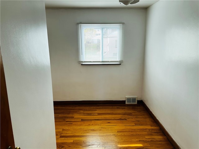 unfurnished room featuring wood-type flooring