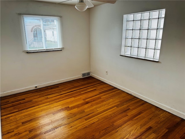 unfurnished room featuring hardwood / wood-style flooring and ceiling fan