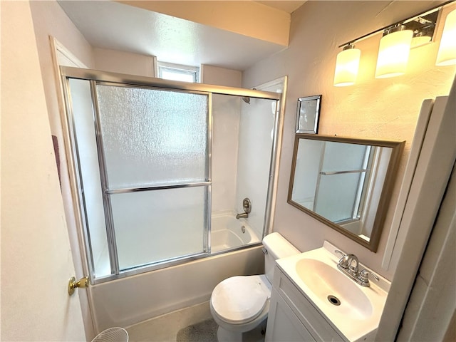 full bathroom featuring vanity, toilet, and combined bath / shower with glass door