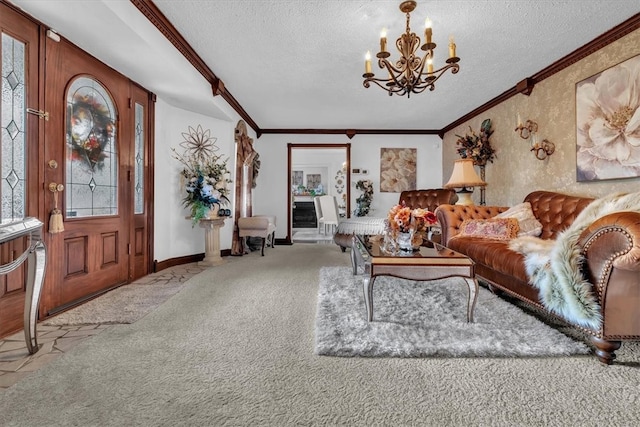 living room featuring ornamental molding, a notable chandelier, a textured ceiling, and carpet