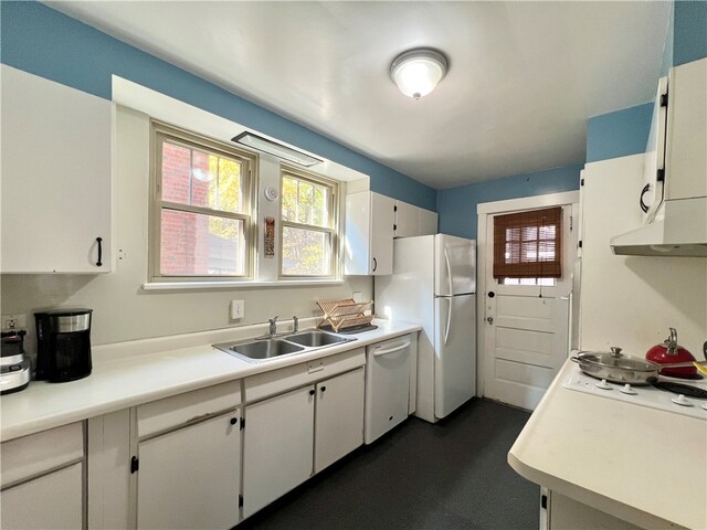 kitchen featuring sink, white cabinetry, white appliances, and extractor fan