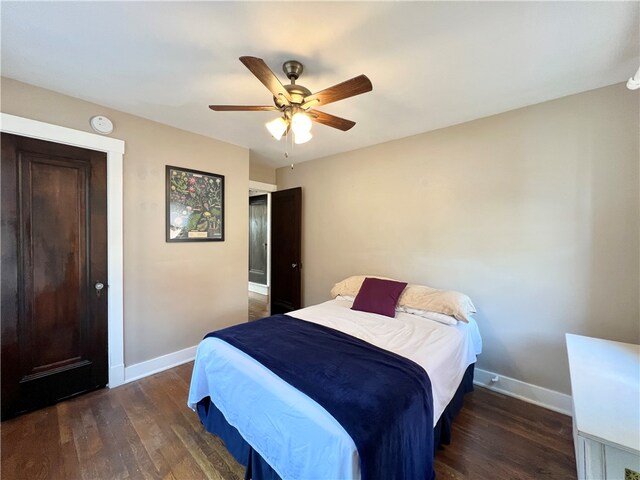 bedroom featuring dark hardwood / wood-style flooring and ceiling fan