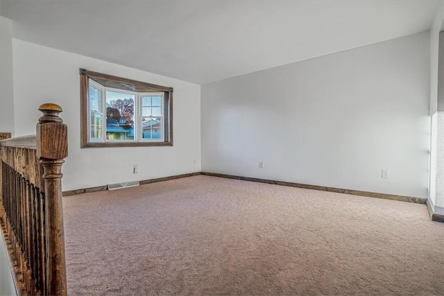 unfurnished living room featuring carpet flooring