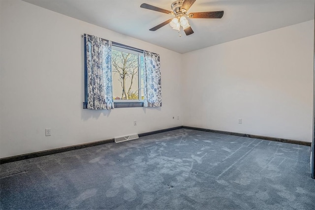 carpeted empty room featuring ceiling fan