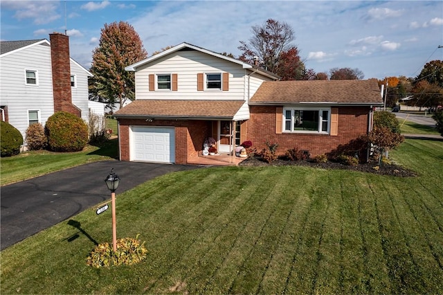 view of front facade with a front yard and a garage