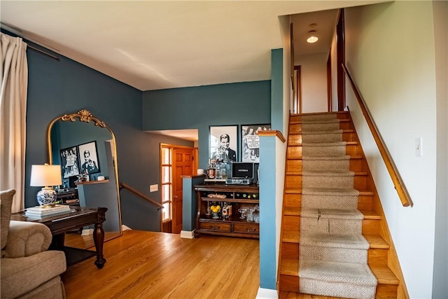 stairway featuring hardwood / wood-style flooring