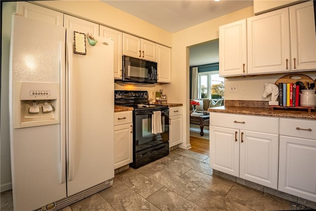 kitchen with white cabinets and black appliances