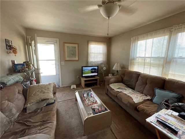 carpeted living room with plenty of natural light and ceiling fan