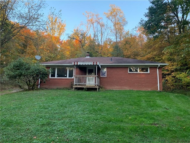 561 Williams Ave, Rochester Twp, PA 15074 - rear view of house with a yard and brick siding