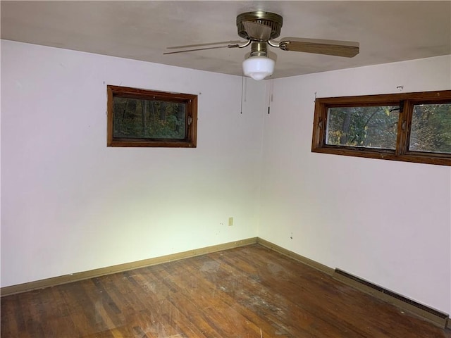 561 Williams Ave, Rochester Twp, PA 15074 - unfurnished room featuring dark wood-type flooring, a ceiling fan, and a baseboard heating unit