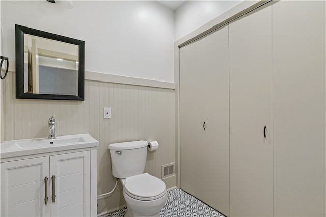 bathroom with toilet and vanity