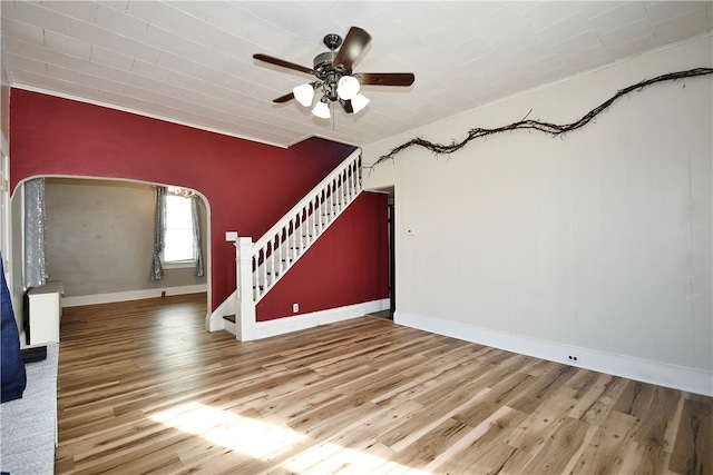 unfurnished living room featuring ornamental molding, hardwood / wood-style flooring, and ceiling fan