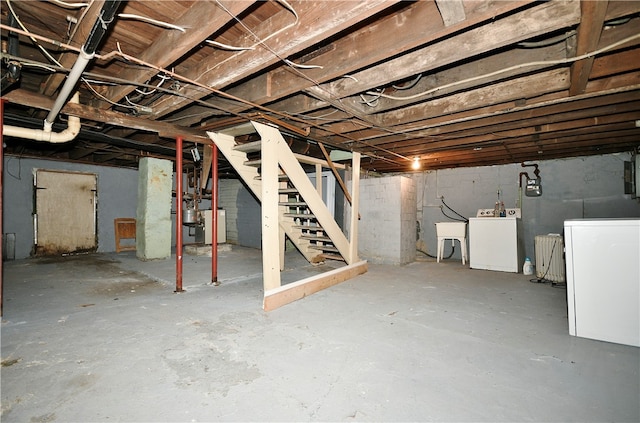 basement featuring independent washer and dryer