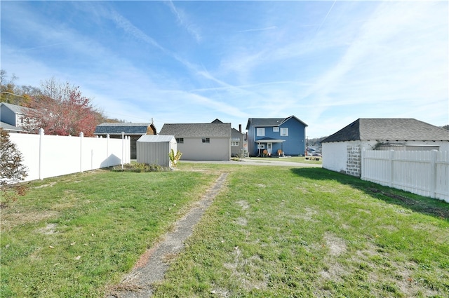 view of yard with a storage unit