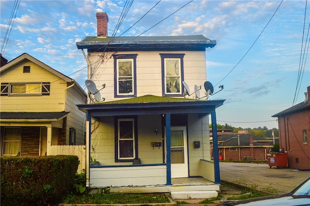 view of front property featuring covered porch