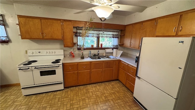 kitchen with ceiling fan, sink, and white appliances