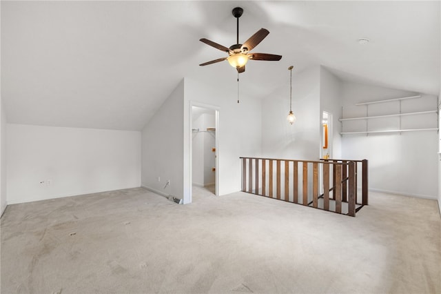 bonus room featuring lofted ceiling and light colored carpet