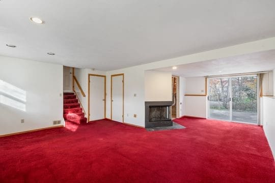 unfurnished living room with carpet