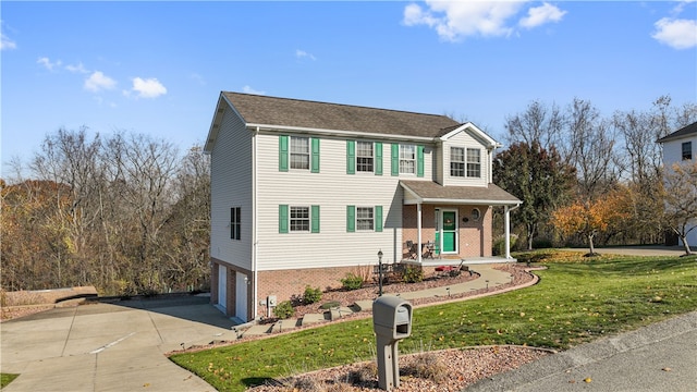 view of front of property featuring a garage and a front lawn