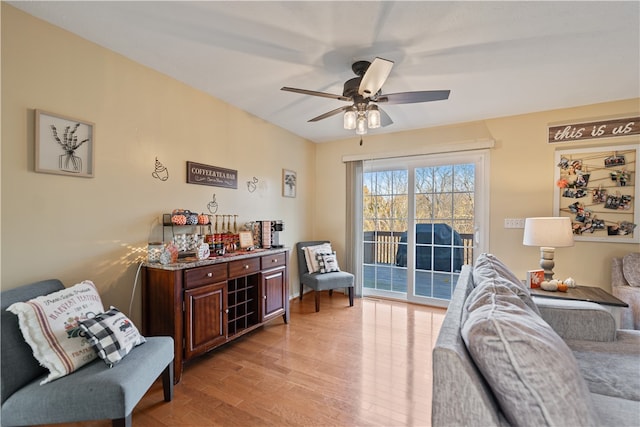 sitting room featuring light hardwood / wood-style floors and ceiling fan