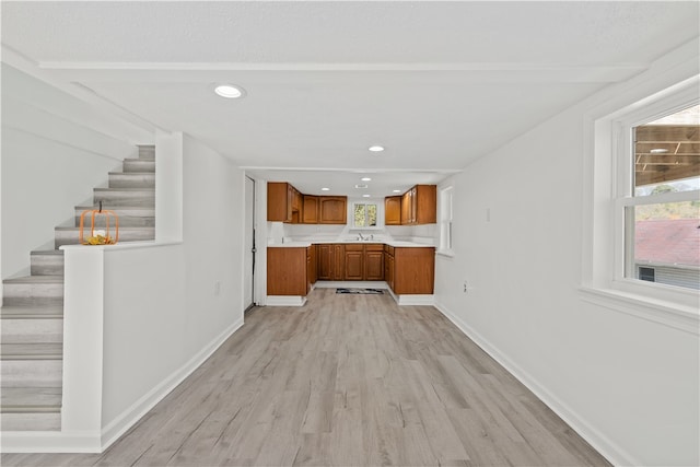 kitchen featuring sink and light wood-type flooring