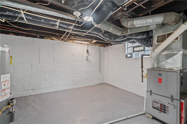 basement with water heater and heating unit